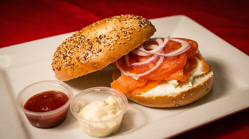 Everything bagel with cream cheese, smoked salmon, tomato, red onion, and two dipping sauces.